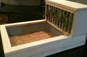 Wooden hay rabbit feeder